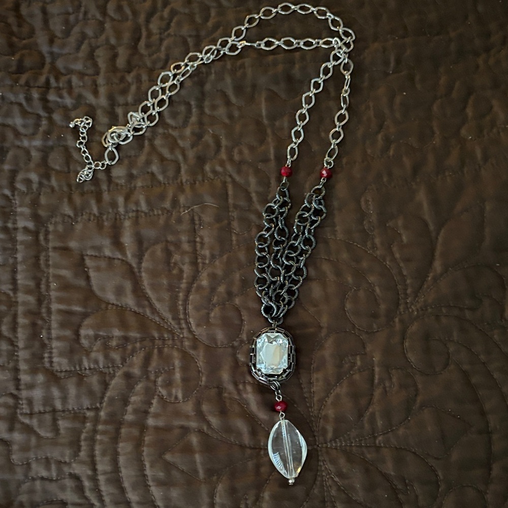 Elegant Silver and Black Necklace with Red Accents